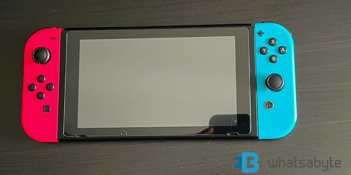 1 Nintendo Switch watermarked whatsabyte on black table