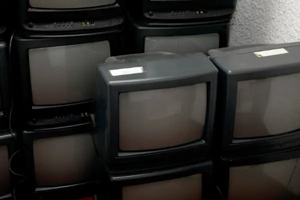 pile of old Tvs
