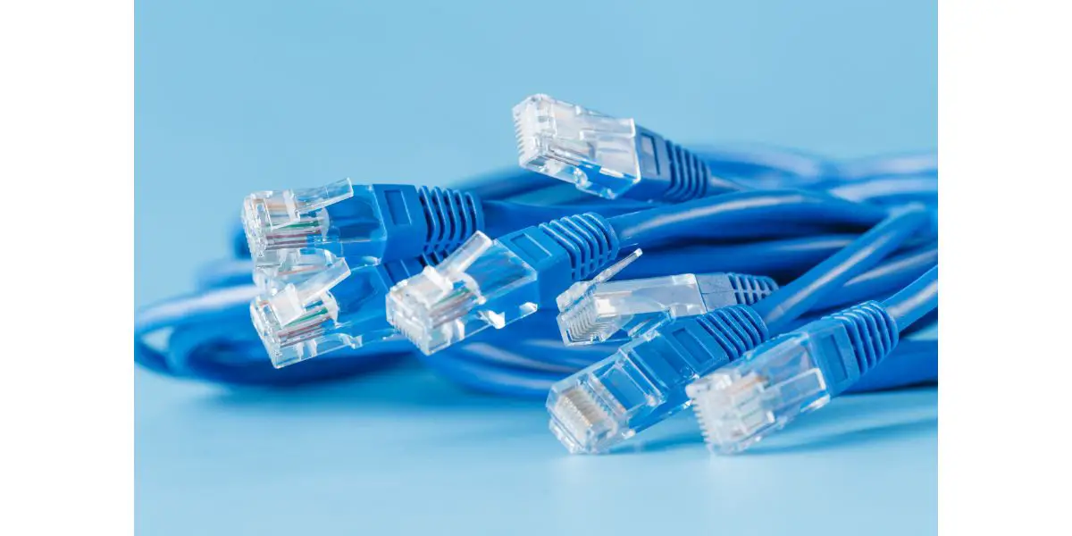 AdobeStock_100146609 blue computer ethernet cable on blue background