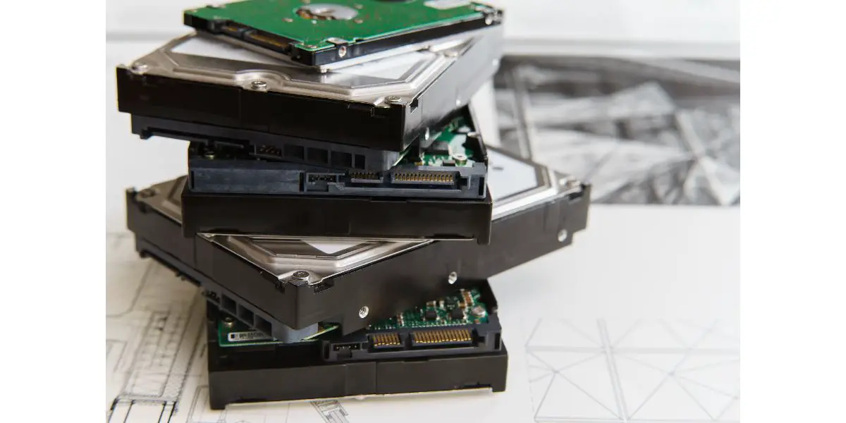 AdobeStock_108866442 pile of hard drives at white background