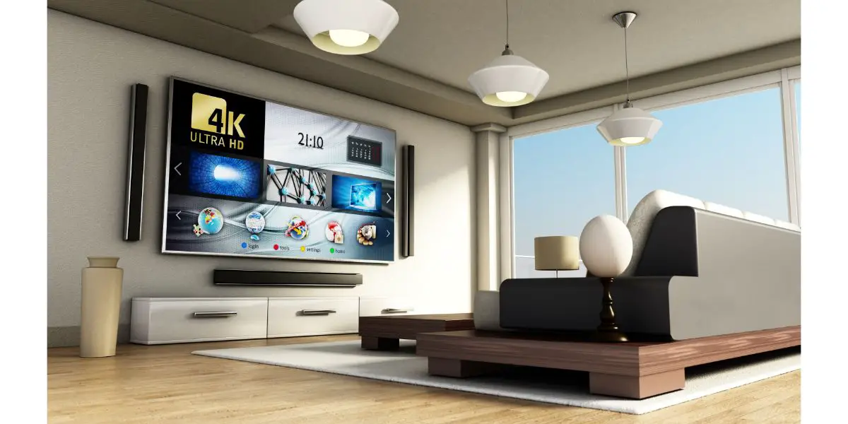 AdobeStock_132290171 Modern 4K smart TV in modern living room with large windows, couch, table, decorations and parquet floor. 3D illustration