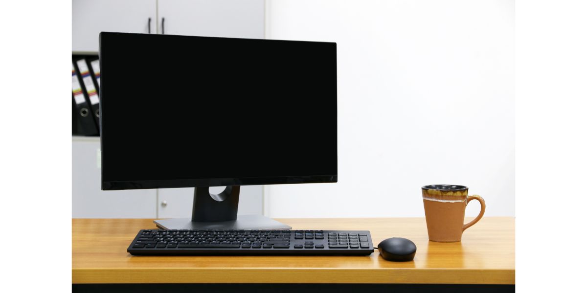 AdobeStock_148405837 computer screen PC and cup of coffee. for business on the table