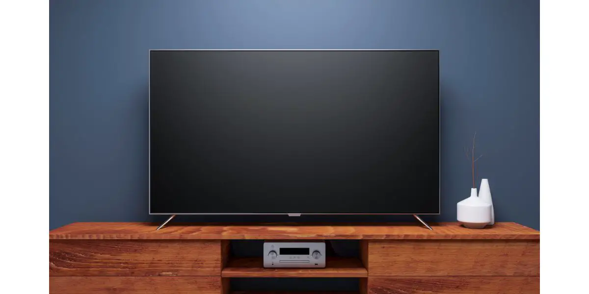 AdobeStock_179411084 Black Smart Tv Mockup on wooden console. 3d rendering