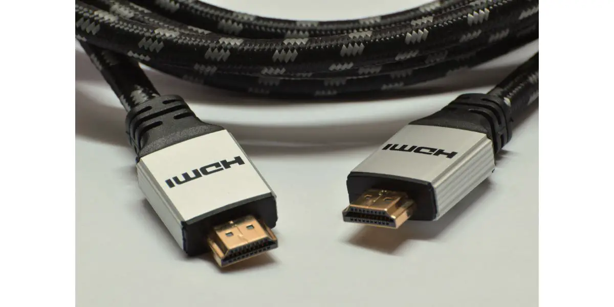 AdobeStock_179540541 Close-up braided grey black hdmi audio and video cable isolated on white background