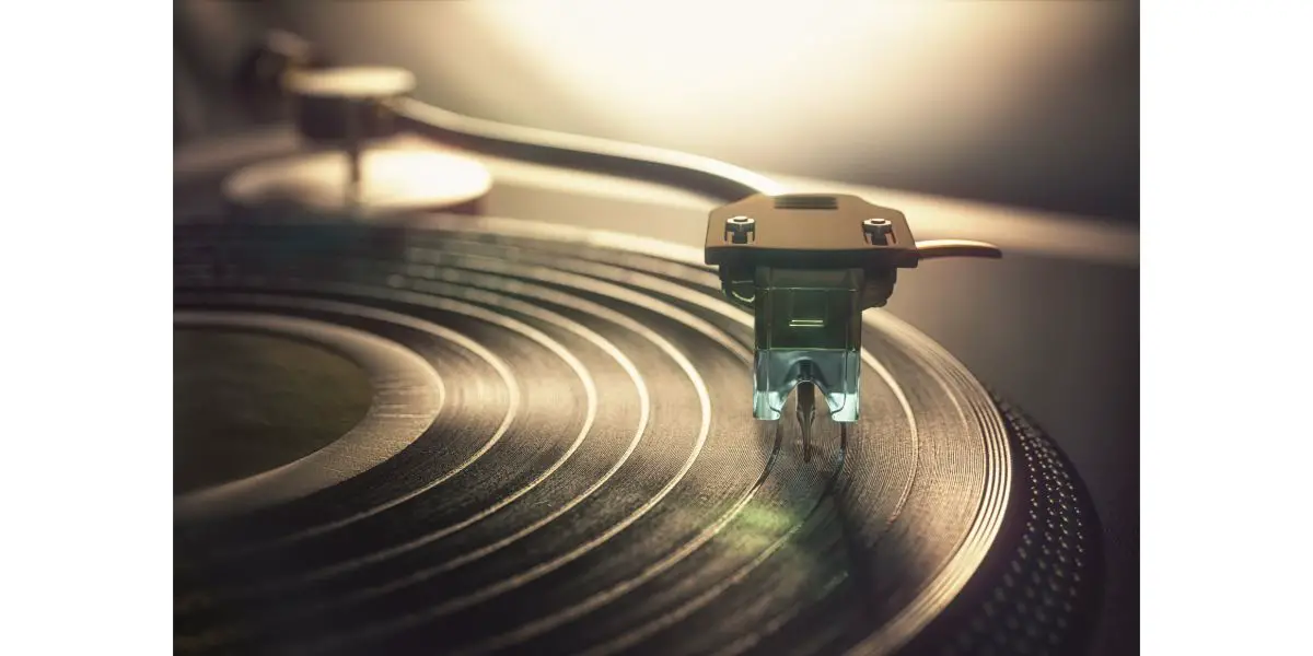 AdobeStock_217596967 Vinyl record being played on old retro vintage disc jockey device