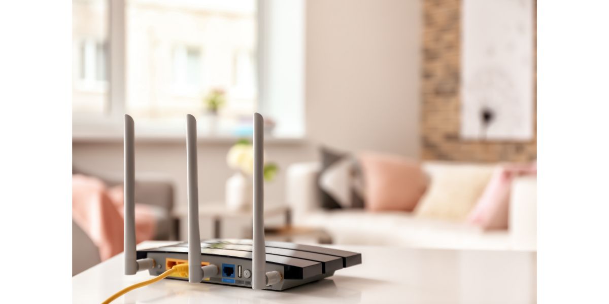 AdobeStock_239323884 Modern wi-fi router on light table in room in living room