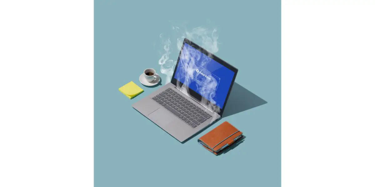 AdobeStock_268496365 System failure and overheating laptop next to coffee, sticky notes and a wallet on light blue background