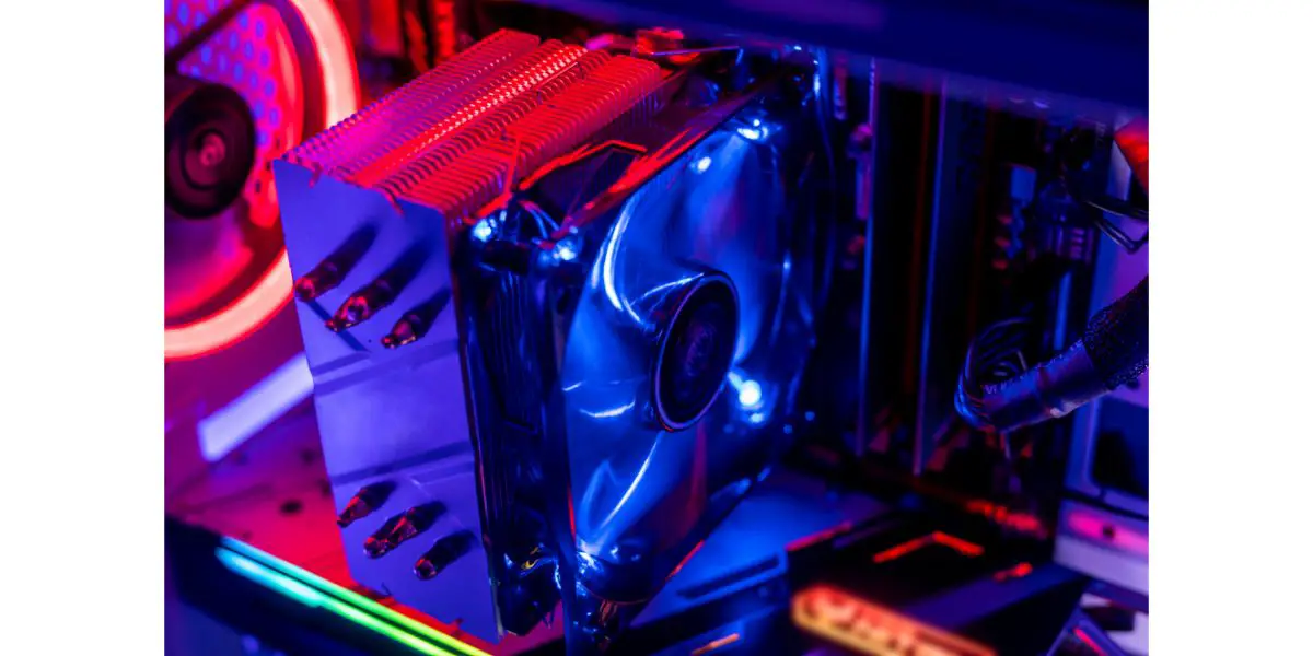 AdobeStock_313040635 new rgb color cooler ventilater installed on the cpu in gaming pc computer dimly lit