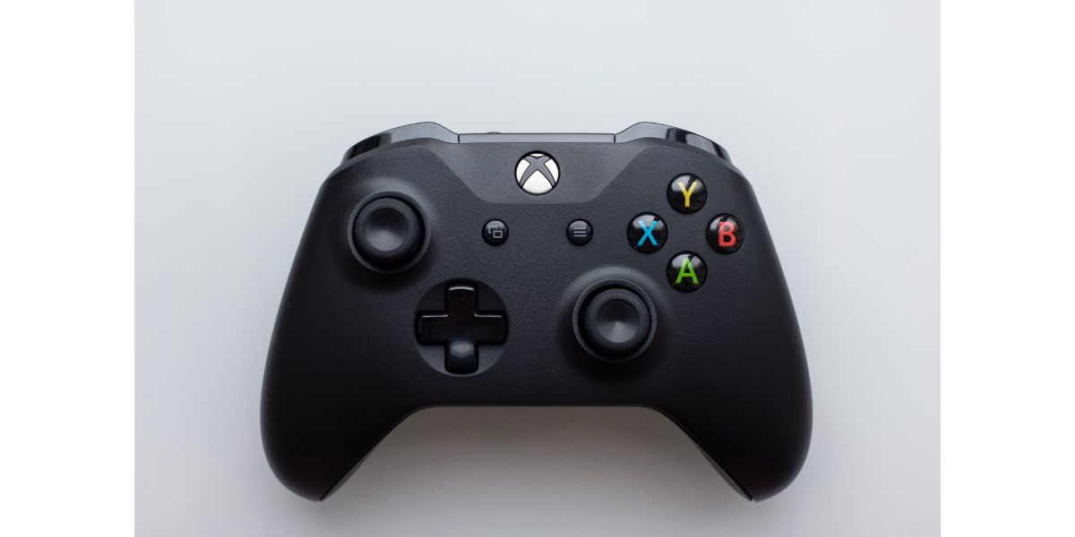 AdobeStock_323235639_Editorial_Use_Only Xbox one gamepad, top view white background