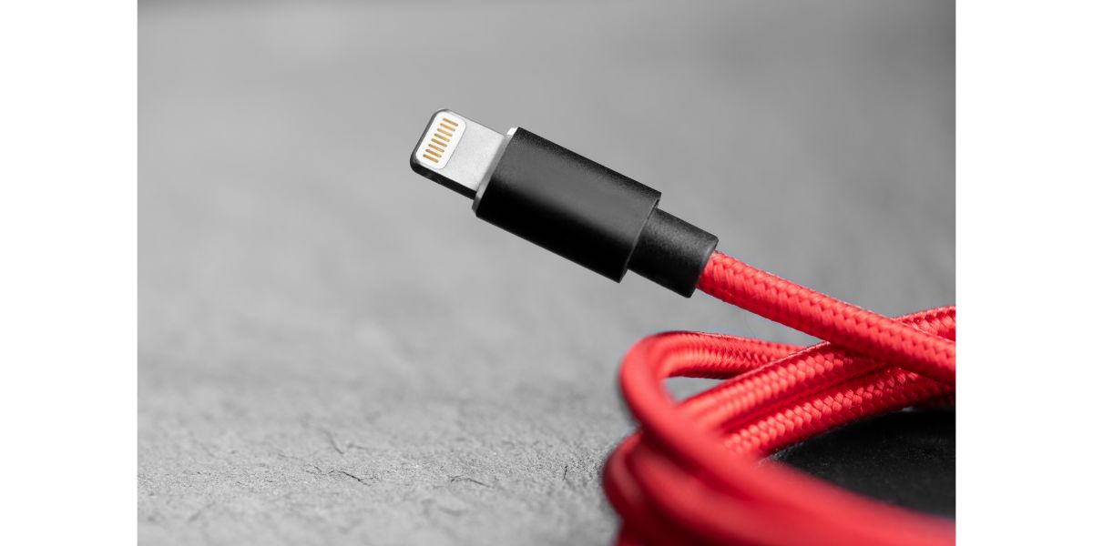 AdobeStock_328307145 red nylon braided 8-pin lightning cable cord for smartphone and electronics