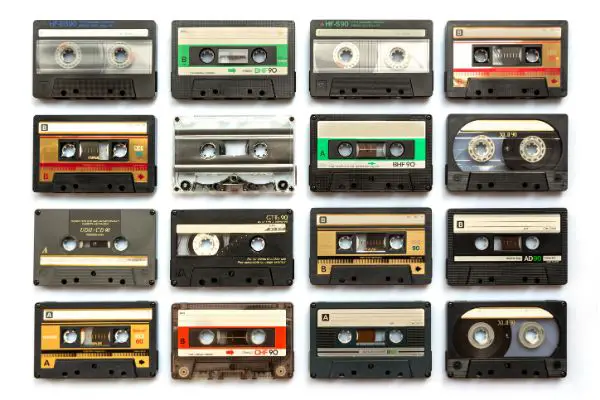 AdobeStock_363168274 Collection of old audio cassette tapes isolated on white background, vintage music and technology concept