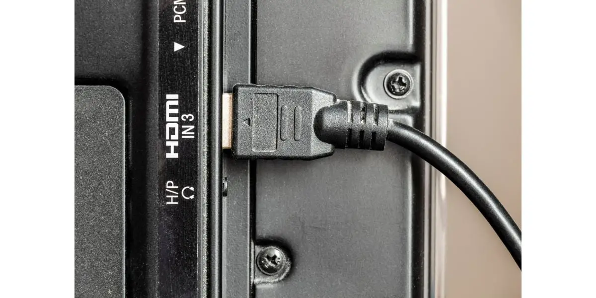 AdobeStock_377470053 HDMi cable is plugged into the TV jack