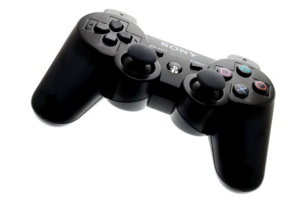 AdobeStock_378317609_Editorial_Use_Only Play Station Wireless PS3 Hand Controller on a white background