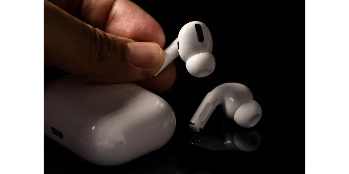 AdobeStock_388919461_Editorial_Use_Only Apple Airpods Pro being help by person hand