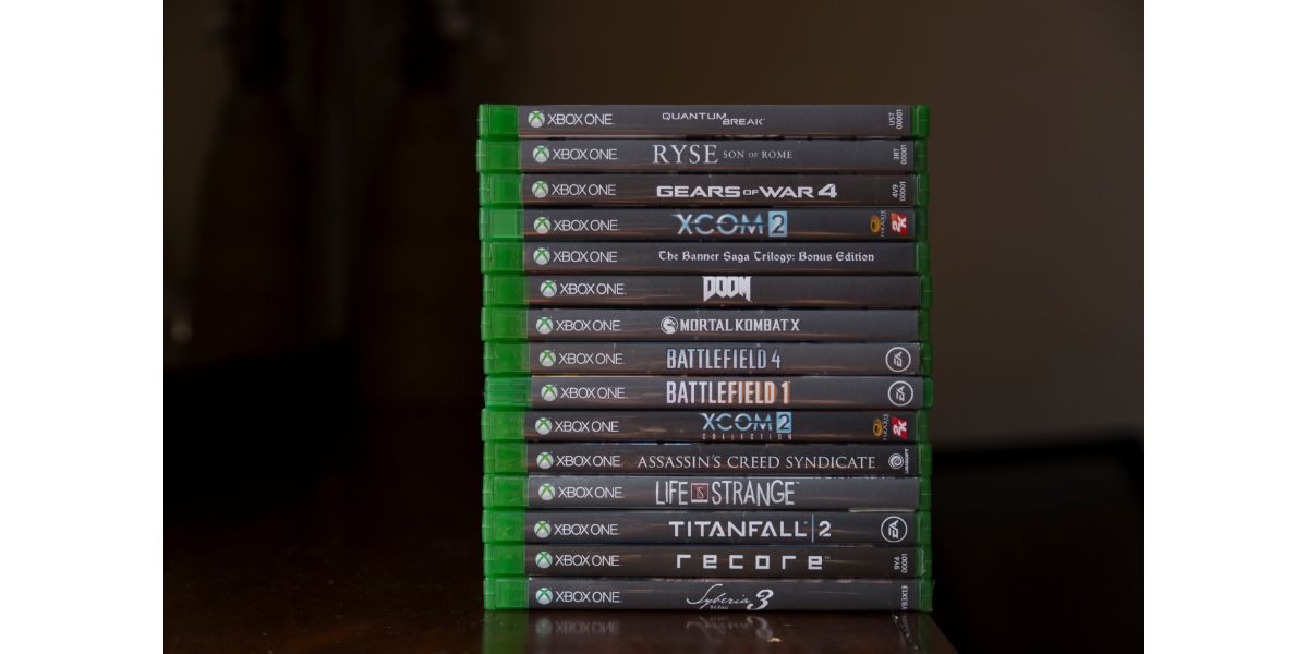 AdobeStock_395882817_Editorial_Use_Only A bunch of Xbox game discs is stacking on top of each other