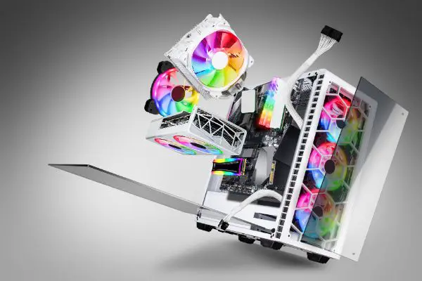 AdobeStock_412353282 exploded view of white gaming pc computer with glass windows and rainbow rgb LED lights. Flying hardware components abstract concept technology