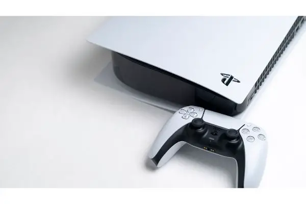 AdobeStock_419034682_Editorial_Use_Only Presentation of a new product from Sony, wireless white console PlayStation 5 and gamepad on white background, game