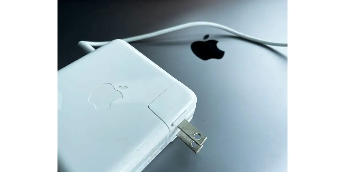 AdobeStock_423625629_Editorial_Use_Only Apple Macbook Laptop and Magsafe power adapter