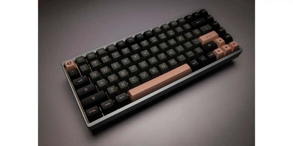 AdobeStock_441319449 Custom slanted black and brown mechanical keyboard on greyscale background