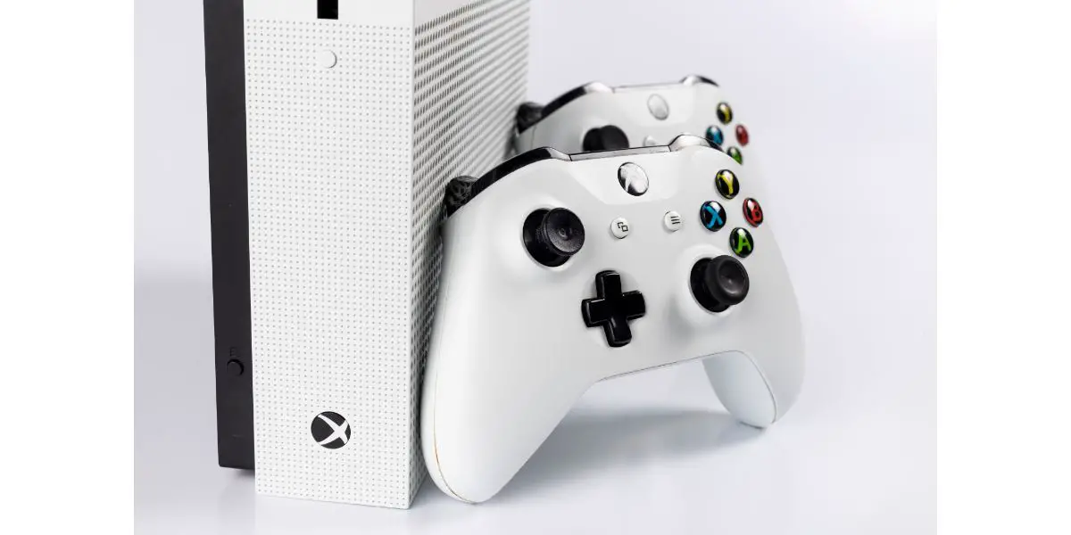 AdobeStock_446666048_Editorial_Use_Only White Xbox One and 2 Controllers on White Background