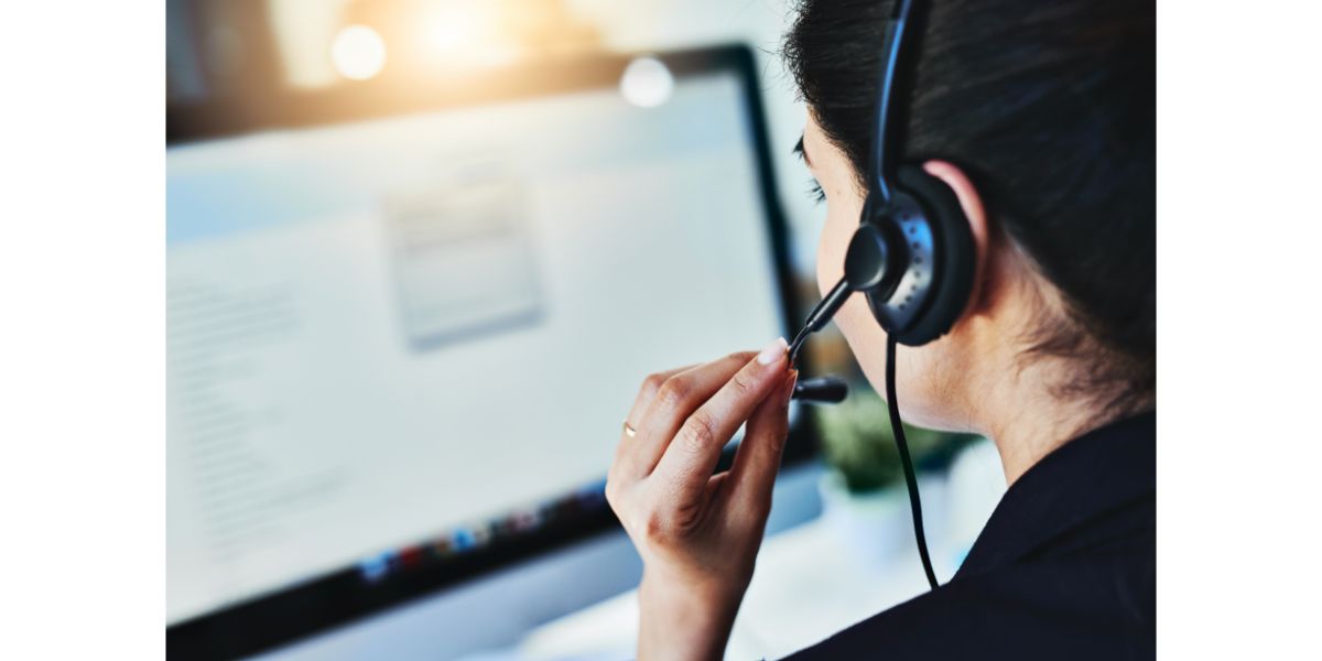 AdobeStock_487257870 Managing the days inquiries. Rearview shot of a young woman working in a call centre