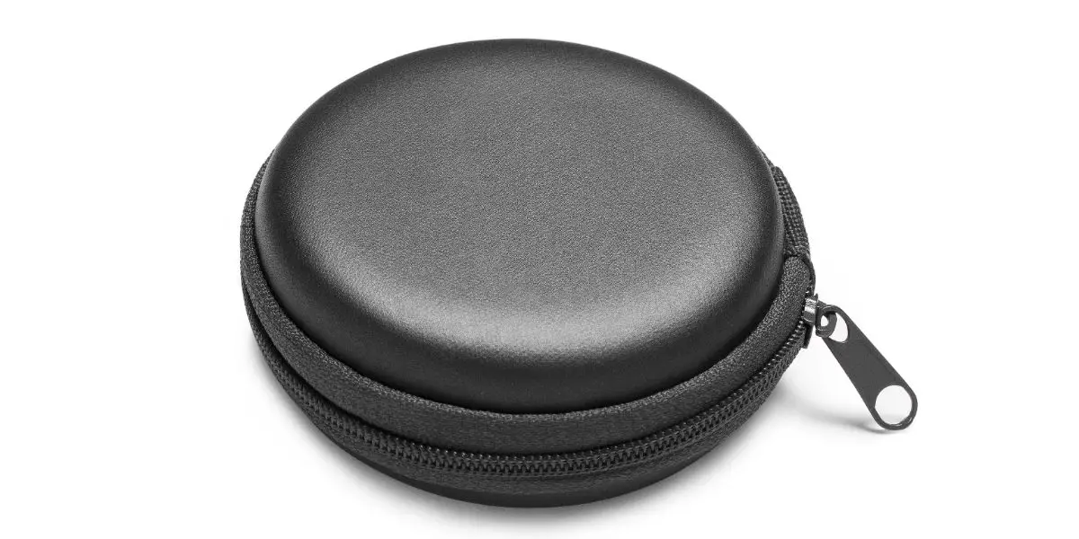 AdobeStock_521790584 Black round headphones pouch with a zipper, isolated on white background