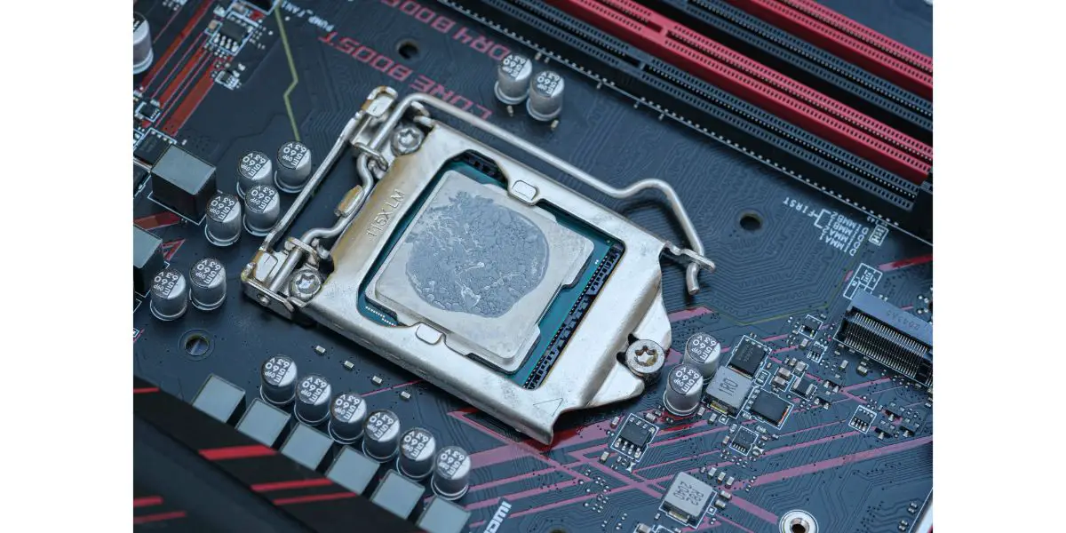 AdobeStock_531303925 Pc cpu with dried thermal paste on hi tech motherboard,computer components chip
