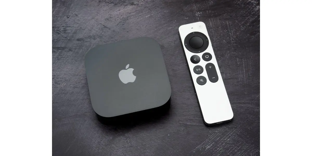 Product shot of the Apple TV 4k 2022 128Gb RAM, and with Siri Remote on graphite background