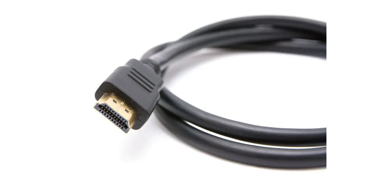 AdobeStock_98140512 black HDMI cable coiled up on white background