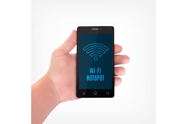 Depositphotos_120846774_S man hand holding a smart phone wi-fi hotspot concept