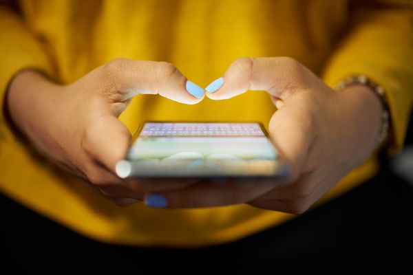 Depositphotos_122289060_S Woman Typing Phone Message On Social Network