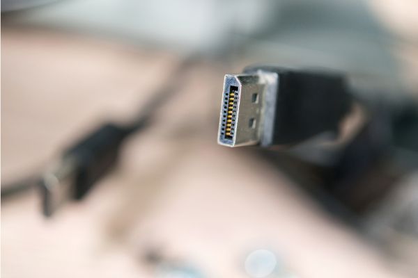 Depositphotos_148290019_S Plug with connector DisplayPort blurred background