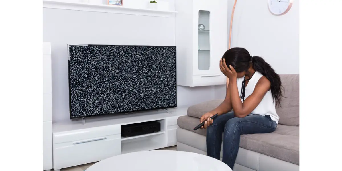 Depositphotos_174750368_L Woman feeling frustrated with loss signal on tv Sitting On Sofa in living room