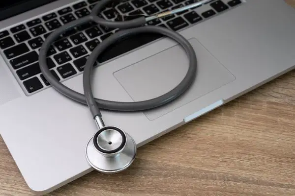 Depositphotos_197720148_S Stethoscope on laptop trouble shooting concept