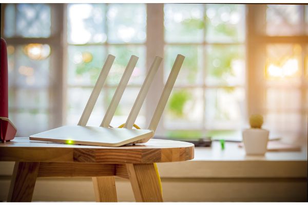 Depositphotos_204200130_S Closeup of a wireless router on living room at home