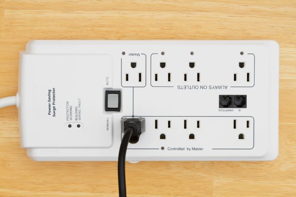 Depositphotos_219640616_S A power saving surge protector on wood