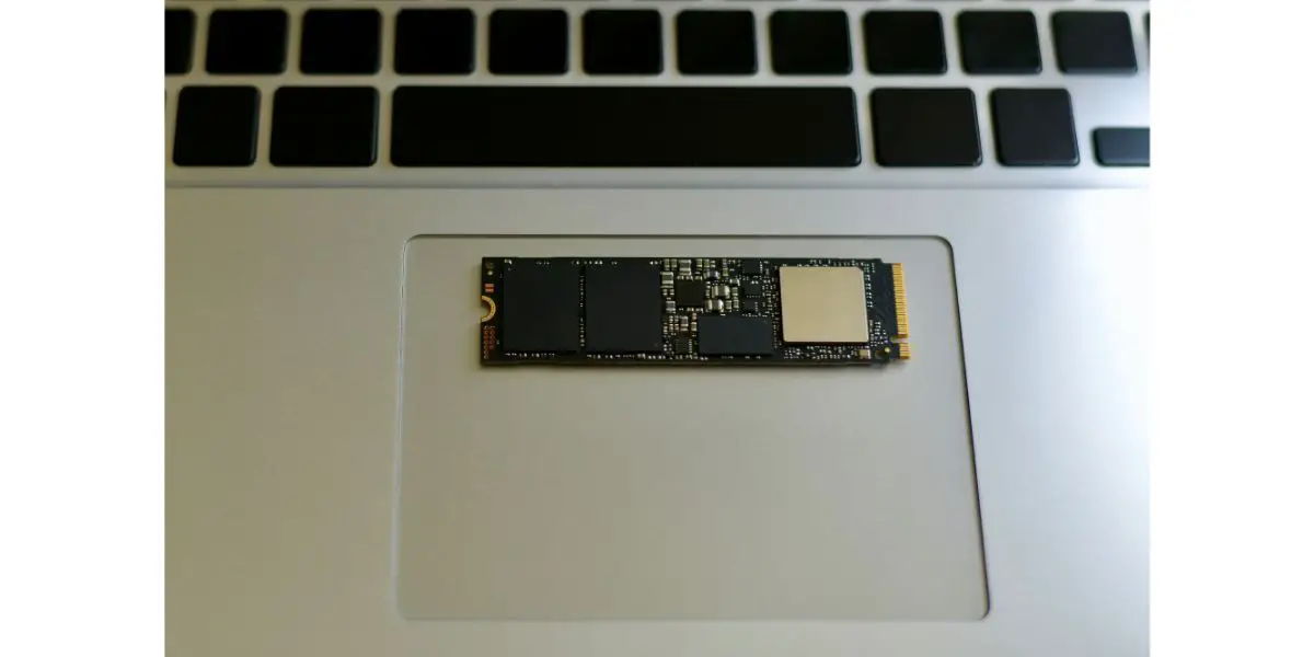 Depositphotos_296648414_L m2 ssd lying on the touchpad of a silver aluminum laptop