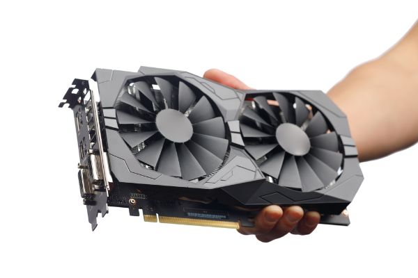 Depositphotos_335030700_S Gpu video card in hand, isolated on white