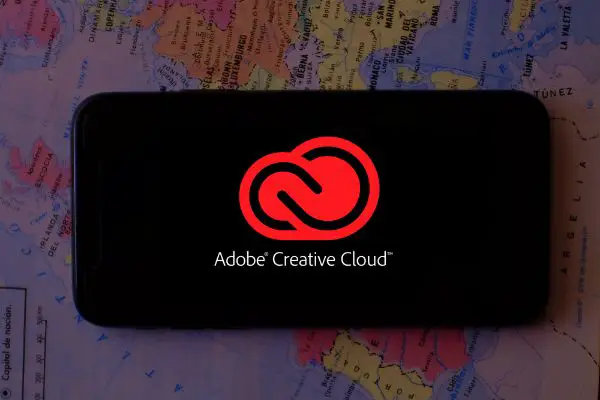Depositphotos_337007510_S Smart phone with the Adobe Creative Cloud logo