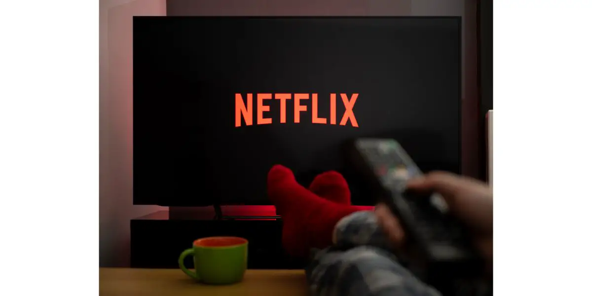 Depositphotos_356995830_L TV Television feet up on table watching Netflix on tv