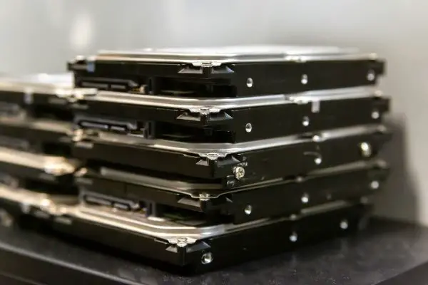 Depositphotos_464906978_S Stack of hard drives for data storage