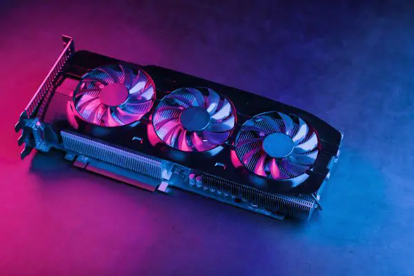 Depositphotos_473163216_S Large and powerful graphics card with three fans with blue pink light. The concept of a cyberpunk video chip for gaming and cryptocurrency mining