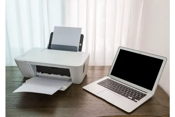 Depositphotos_50953611_S Printer and Laptop on wood table