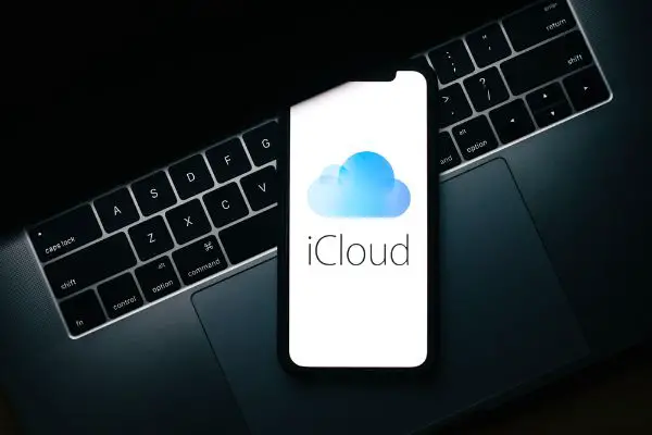 Depositphotos_530174138_S IPhone with apple iCloud logo on the screen.