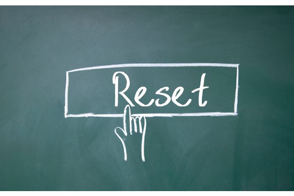 Depositphotos_79683962_S Finger click reset symbol on blackboard