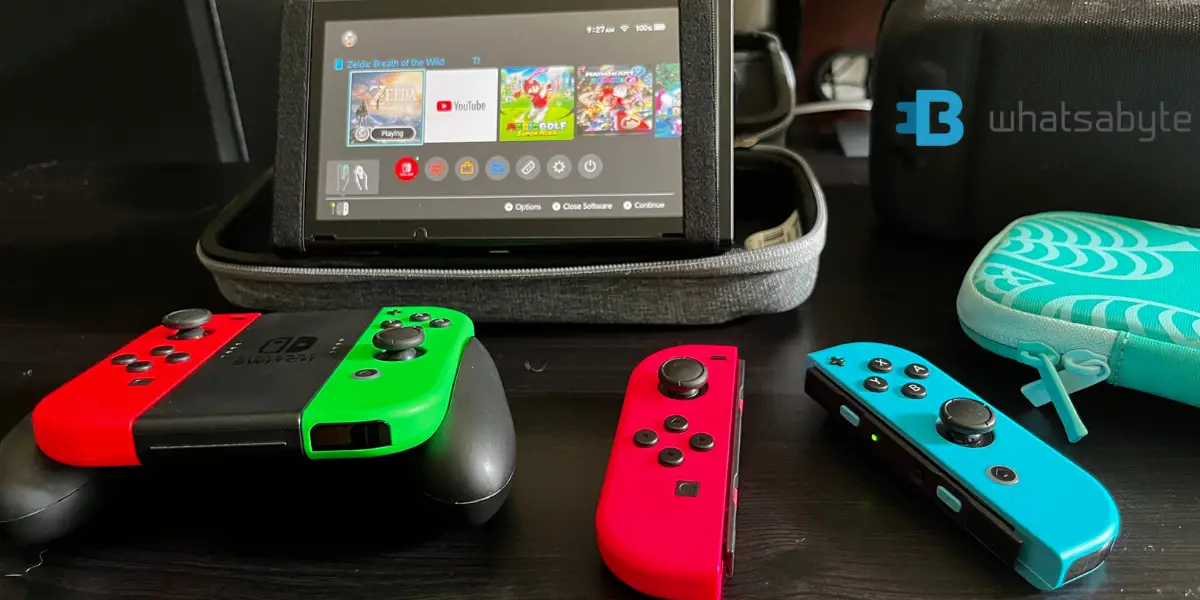 Nintendo switch tablet mode with 2 controllers taken on iphone 11 watermarked whatsabyte