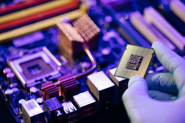 laboratory technician holds powerful processor in his-hands cpu computer processor (1)